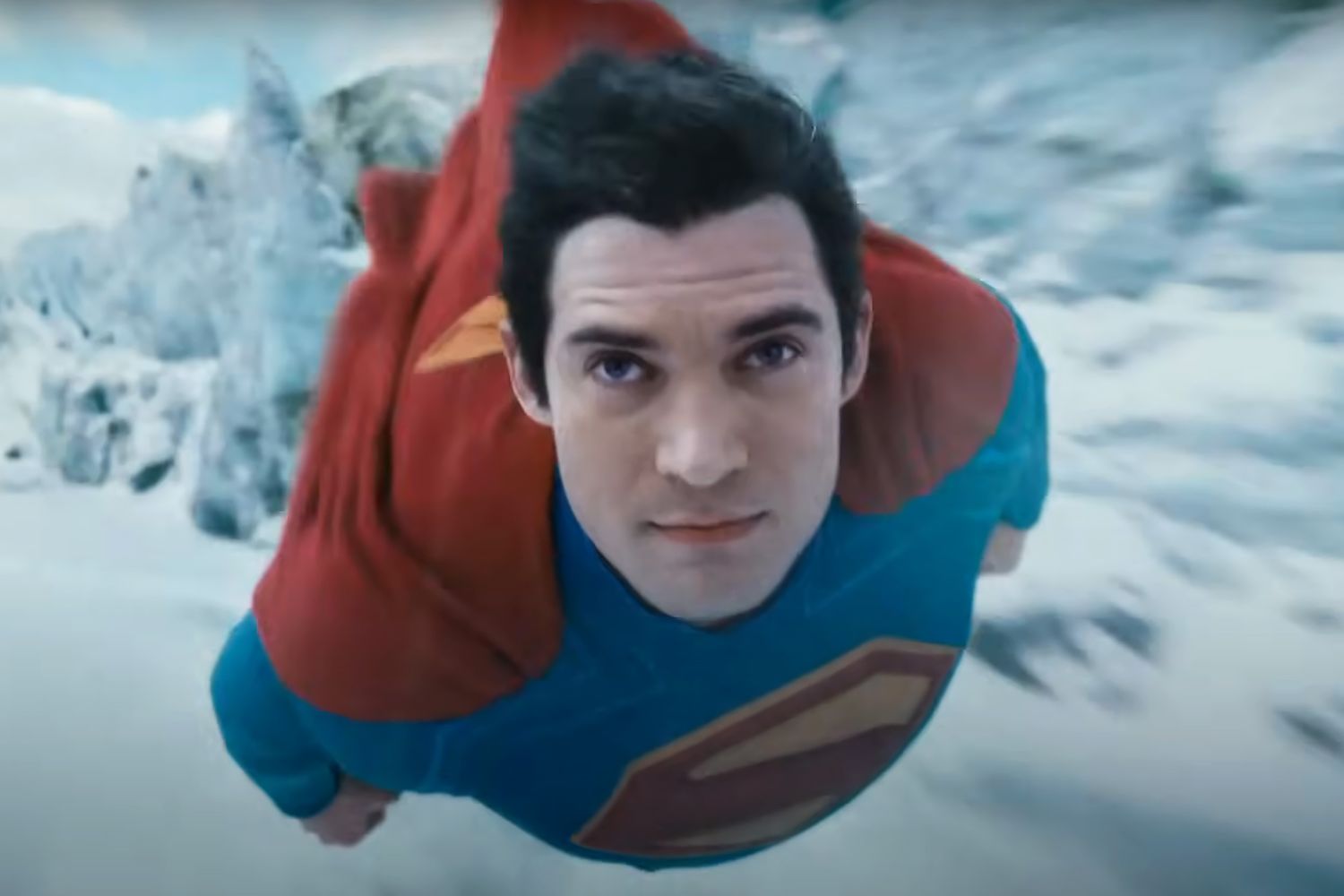 SUPERMAN Holds Up the...